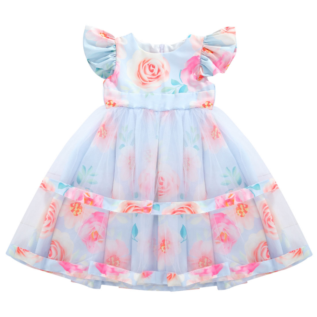 Close-up of a baby girl's floral lace dress with pleated skirt, ideal for kids fashion.