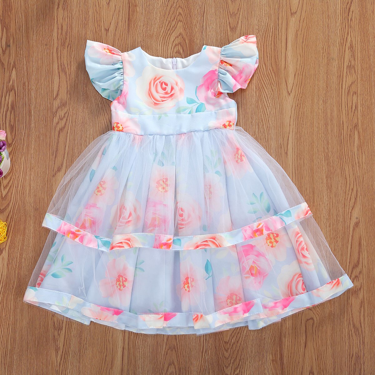 Full shot of a pink floral lace princess dress for toddlers, featuring delicate pleats.