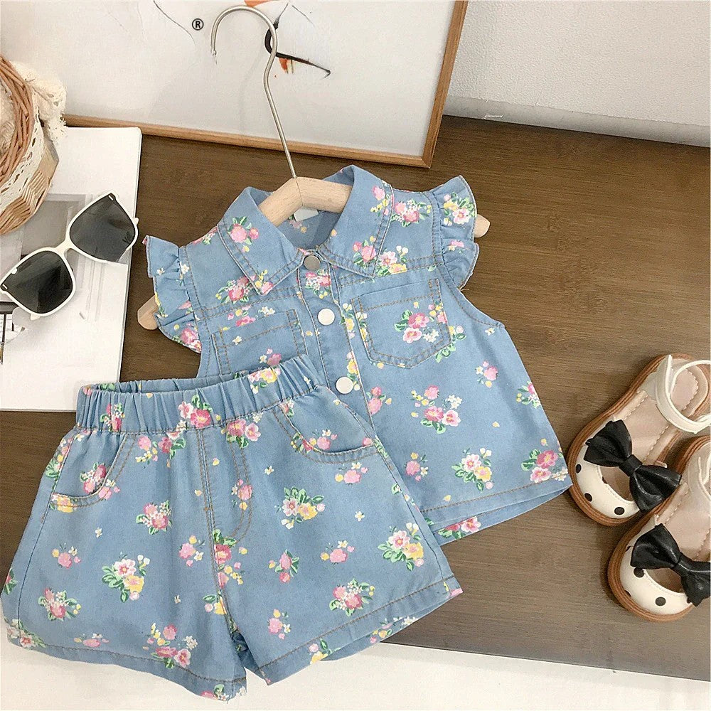 Toddler girl in floral top & soft denim shorts, perfect for summer playwear
