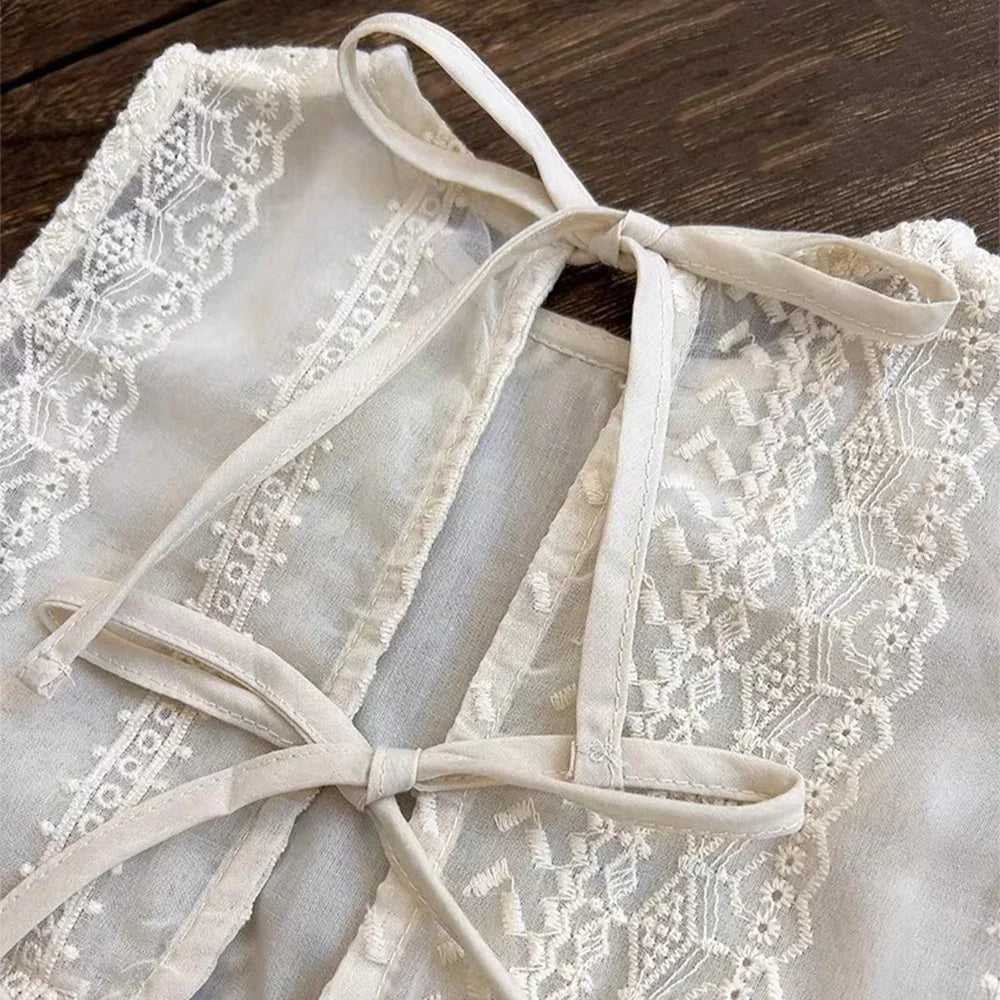 Detail of sleeve on hollow lace toddler top, short sleeve design, perfect for summer casual wear