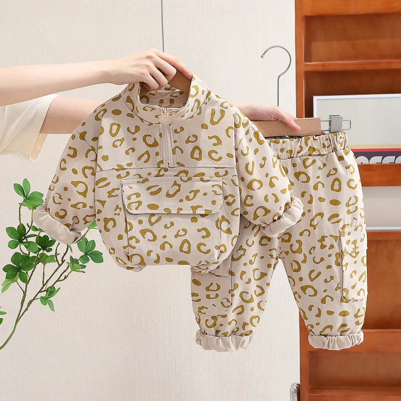Kids' leopard print sweatshirt set, ideal for toddlers, styled with white sneakers, full length.