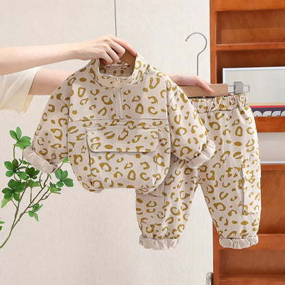 Kids' leopard print sweatshirt set, ideal for toddlers, styled with white sneakers, full length.