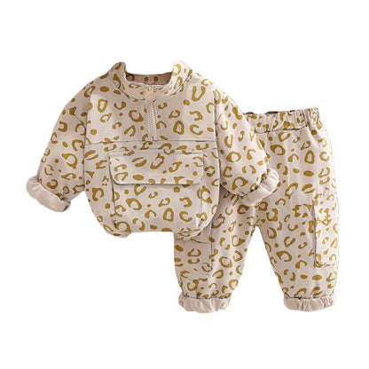 Leopard print sweatshirt from a kids' two-piece set, isolated on white, showcasing design details.