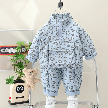 Leopard print pants from a toddler two-piece set, comfortable children's apparel, white background.