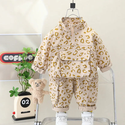 Detailed image of the elastic waistband on the leopard print pants, part of a kids' two-piece set.