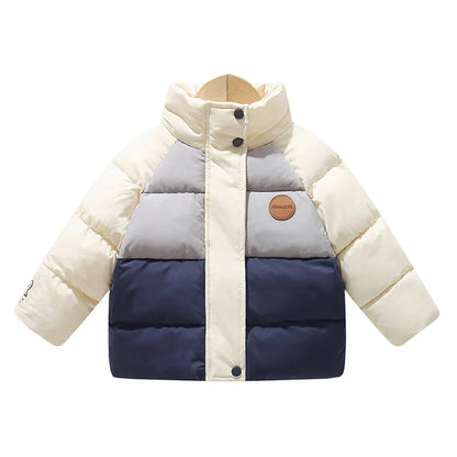 Back view of a child wearing a blue polka dot winter coat, warm insulated toddler outerwear