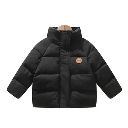 Detailed shot of zipper and pockets on a child's polka dot winter coat, warm boys jacket
