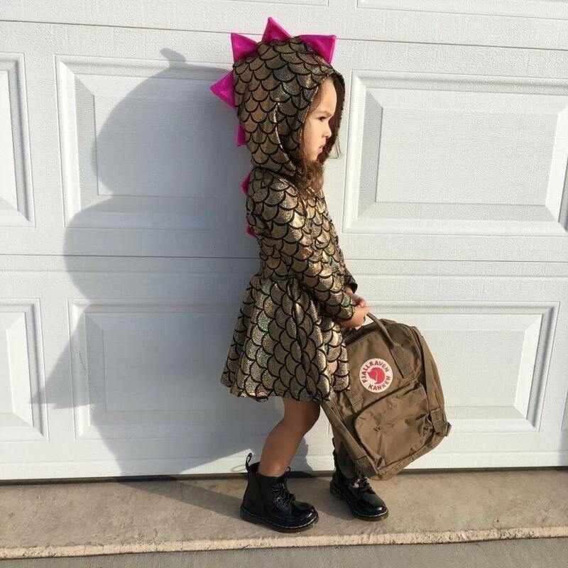 Close-up of girls' shimmer dinosaur hooded dress, showcasing cute dinosaur detail and soft cotton blend.