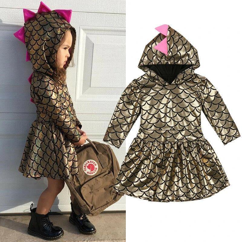 Girls' hooded dress with shimmering pink fabric and fun dinosaur spikes, ideal toddler clothing.