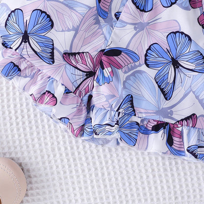 Close-up of the skirt of a purple girls' princess dress, showing flowy material and fancy design