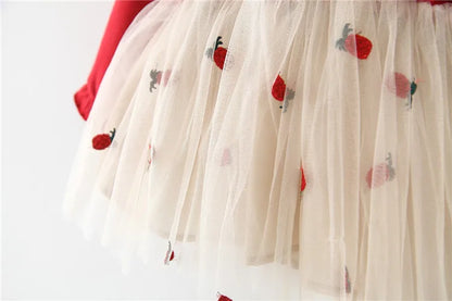 Flat lay of a red lace long sleeve toddler dress, showcasing its elegant design and fabric.