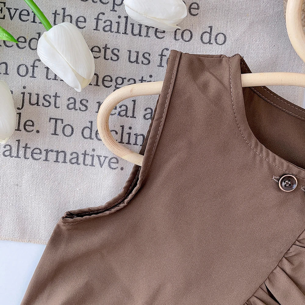 Full view of girls' summer outfit: striped top and polka dot pants set, perfect for warm weather.