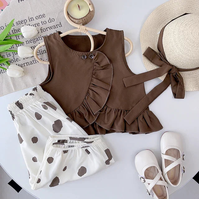Adorable toddler girls' summer wear: light blue striped top and navy polka dot pants combo.