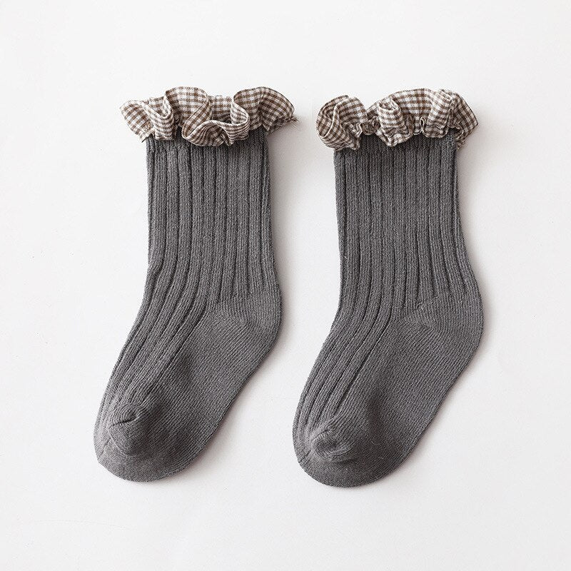 Cute toddler girl's ankle socks, featuring a stylish checkered knit in pink and white