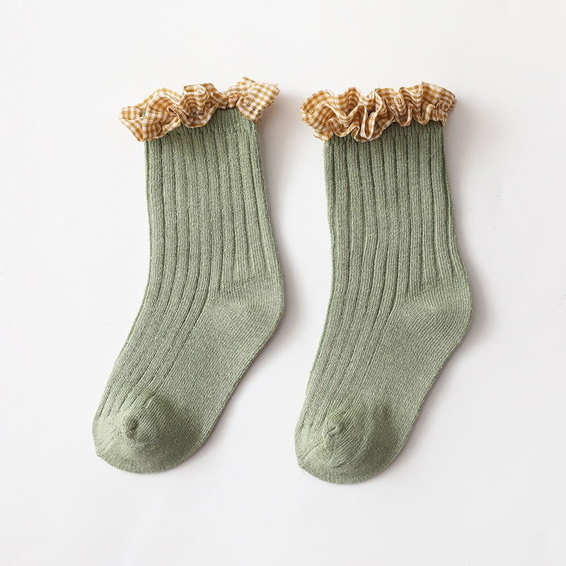 Soft knit ankle socks for toddler girls, showcasing a modern pink and white checkered print