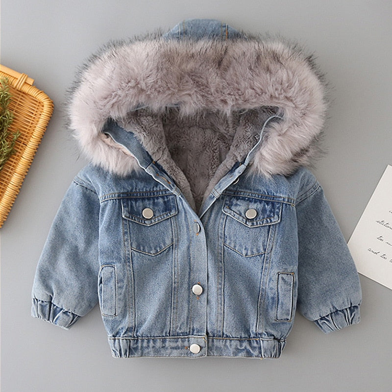 Baby girl's warm winter coat: classic denim jacket with a fashionable faux fur hood for comfort.