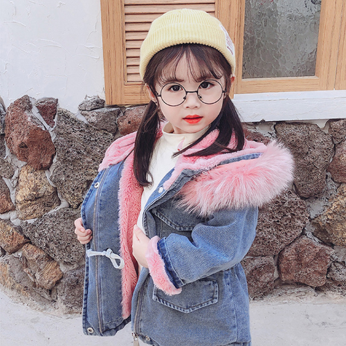 Girls' casual denim jacket with a luxurious faux fur hood, a stylish and warm kids outerwear piece.
