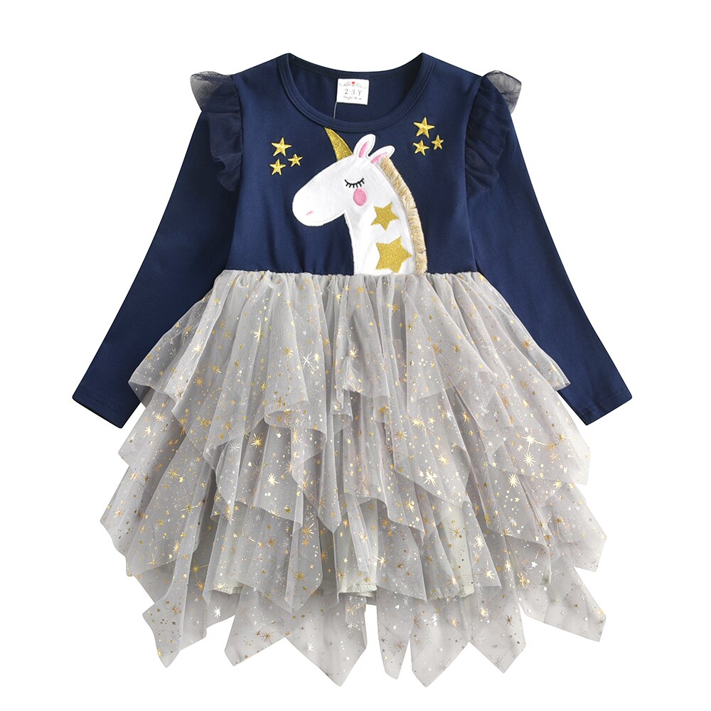 Model shot of a girls' festive snowflake long sleeve mesh dress, showcasing the full design.