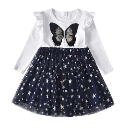 Side view of a toddler's festive snowflake long sleeve mesh dress with a mesh overlay.