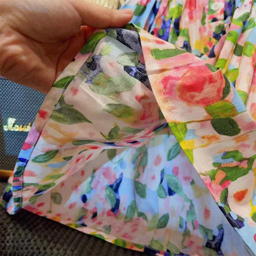 Flat lay of a children's floral print flying sleeve dress for summer fashion