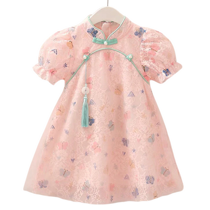 Close-up of a pink floral lace cheongsam dress for girls, featuring delicate butterfly embroidery.
