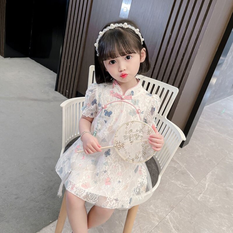 Charming toddler floral lace party dress, cheongsam style with butterfly accents and puff sleeves.