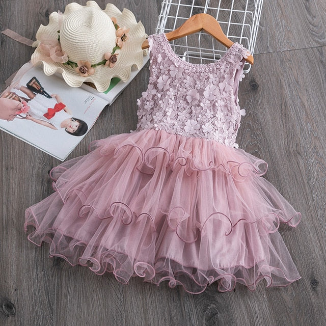 Close-up of a pink floral ruffle tutu dress for toddler girls, perfect for parties