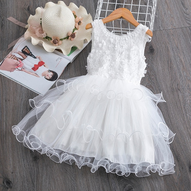 Cute sleeveless floral dress with a voluminous ruffle tutu for a baby girl's special occasion