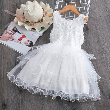 Cute sleeveless floral dress with a voluminous ruffle tutu for a baby girl's special occasion