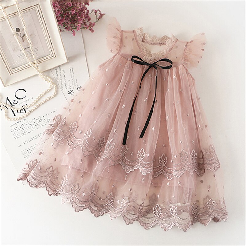 Kids fashion: baby girl in a beautiful floral ruffle tutu dress, ideal for a festive event
