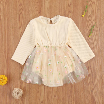 Toddler girl's knit autumn romper in princess style, long sleeve. Cozy baby outfit.