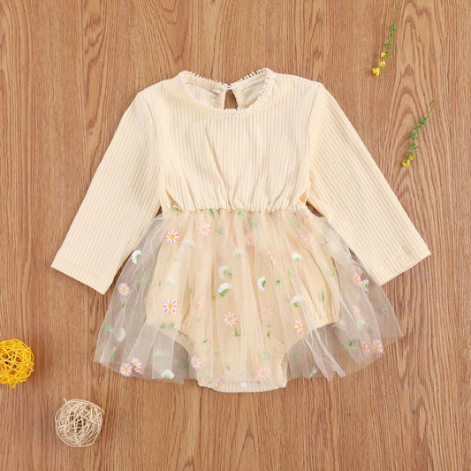 Toddler girl's knit autumn romper in princess style, long sleeve. Cozy baby outfit.