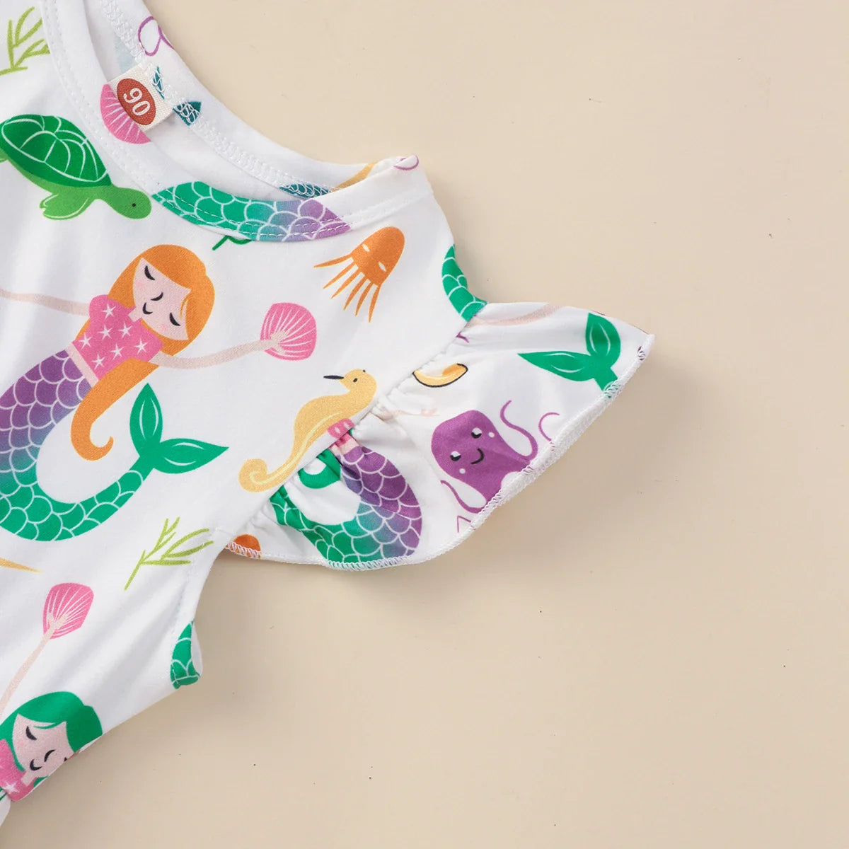 Collection of girls' mermaid print ruffled summer dresses in various sizes for kids' fashion