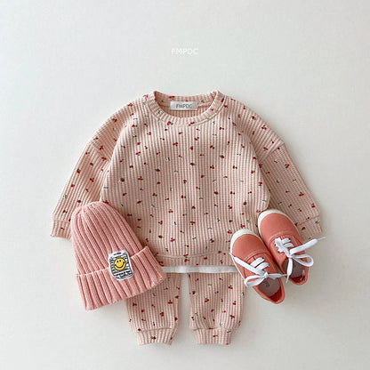 Toddler girl's multi-print top with cute ruffles, paired with matching cotton pants for spring/autumn.