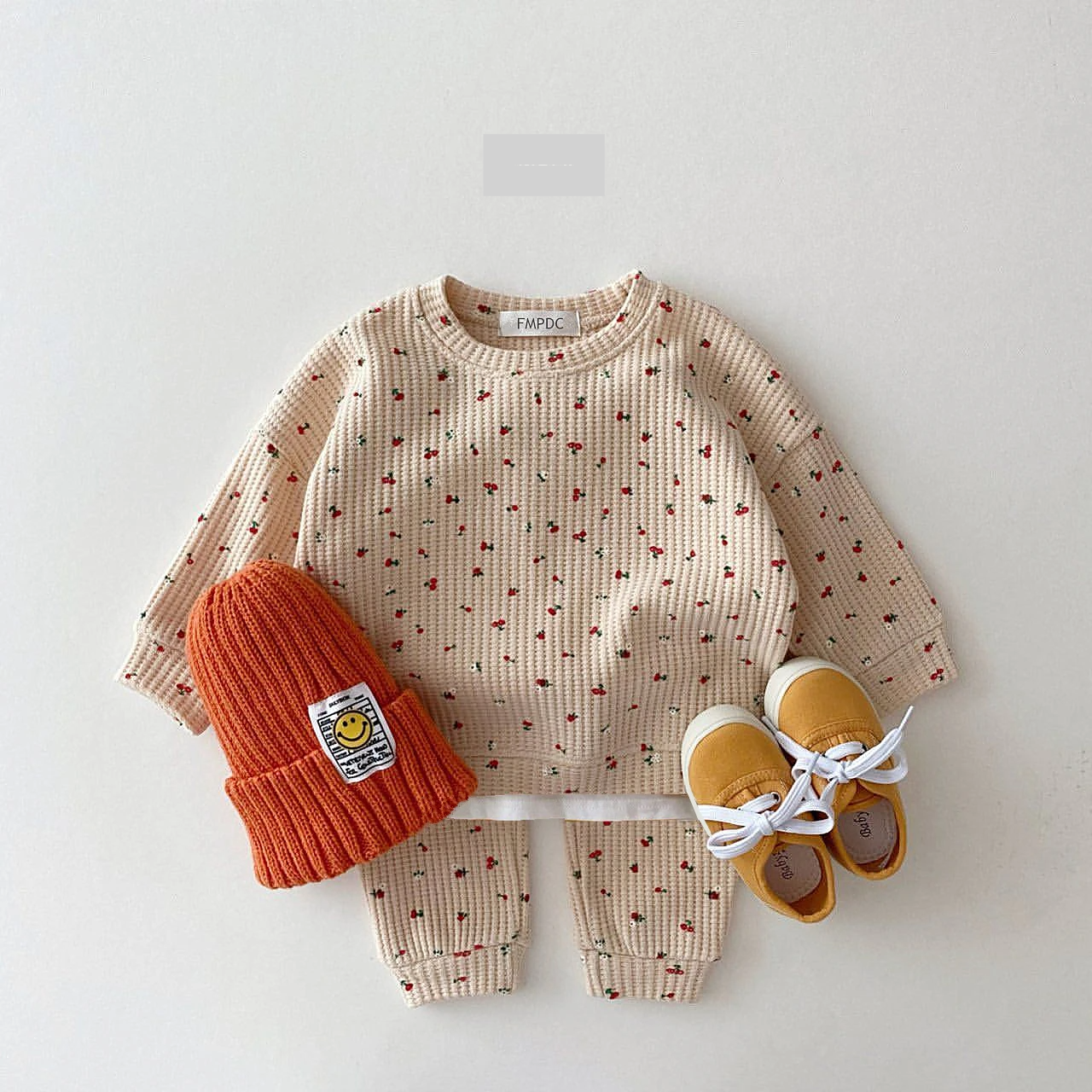 Close-up of vibrant multi-print cotton top for toddler girls, part of a comfy spring/autumn outfit set.