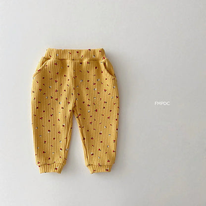 Full view of multi-print cotton pants for toddler girls. Soft baby clothes for spring/autumn playwear.