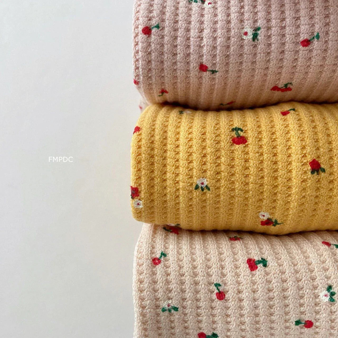 Detailed image of the multi-print pattern on a toddler girl's cotton outfit, comfortable and stylish.