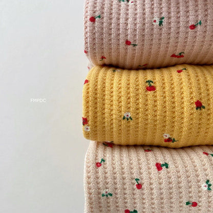 Detailed image of the multi-print pattern on a toddler girl's cotton outfit, comfortable and stylish.