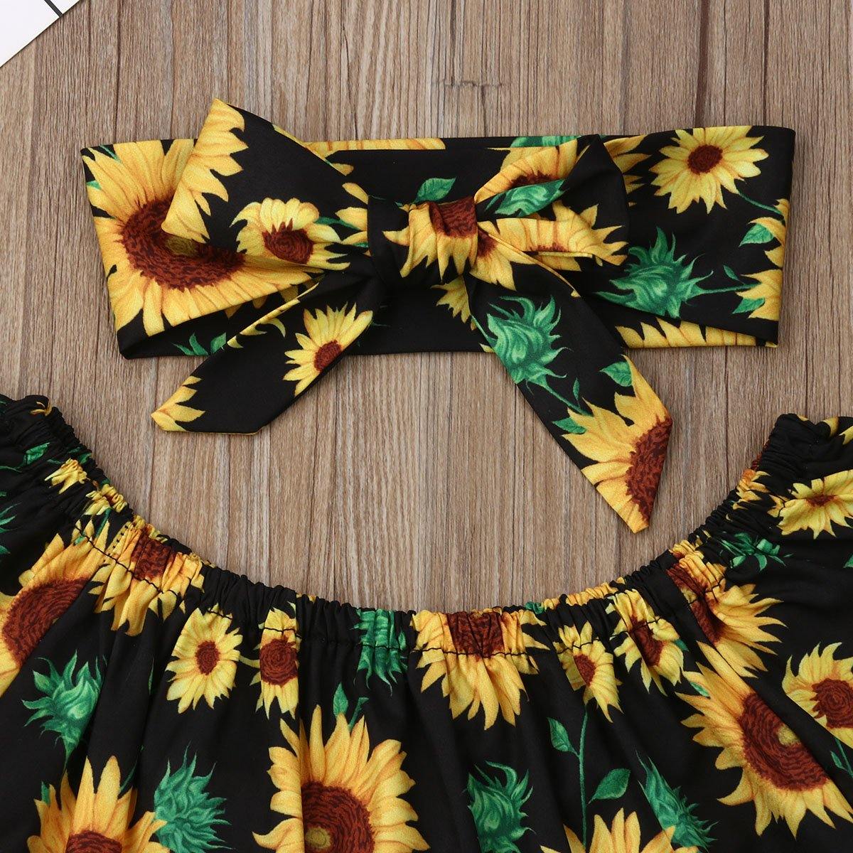 Girls' cotton blend off-shoulder sunflower top and ripped jeans, a trendy and comfortable toddler fashion set.
