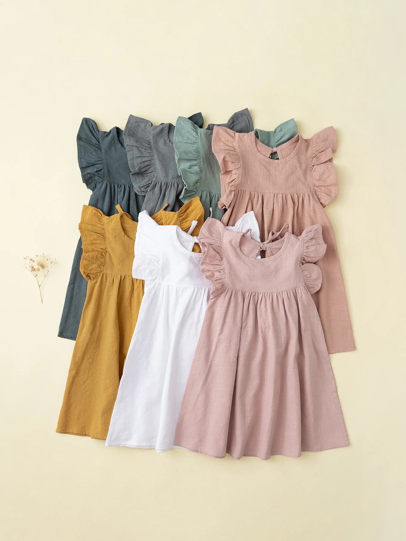 Toddler girl's pink cotton tie-back overall dress, perfect for summer casual wear