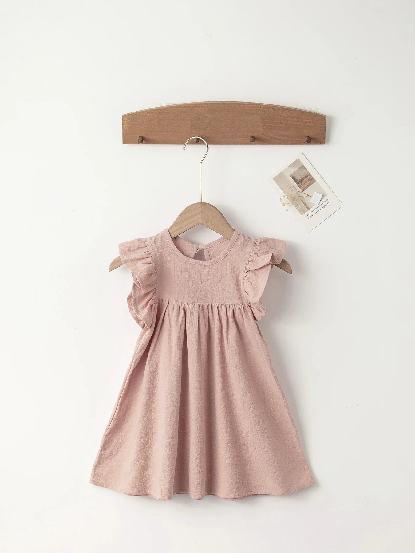Red cotton overall dress with adjustable tie-back straps for girls' summer activities