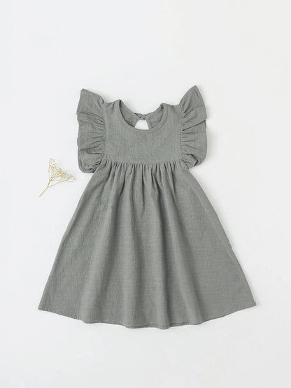 Bright orange girls' cotton tie-back overall dress, perfect for sunny summer outings