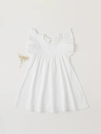 Chambray blue cotton overall dress with tie-back for a casual summer toddler style