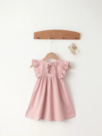Girls' knee-length cotton overall dress in light blue with tie-back detail for summer