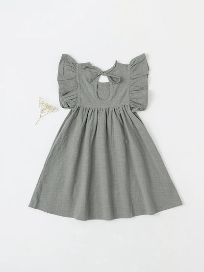 Simple beige cotton overall dress with tie-back, versatile for girls' summer casual