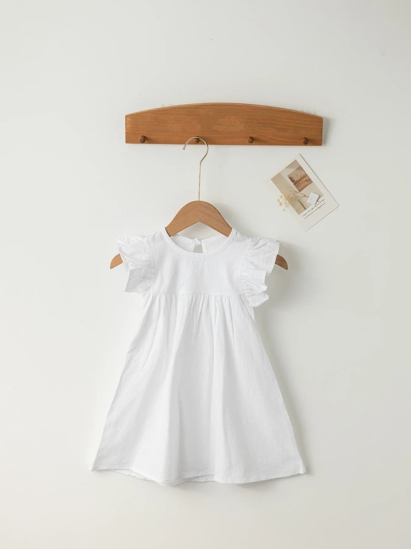 Cute peach cotton overall dress with tie-back for baby girls' summer casual wear