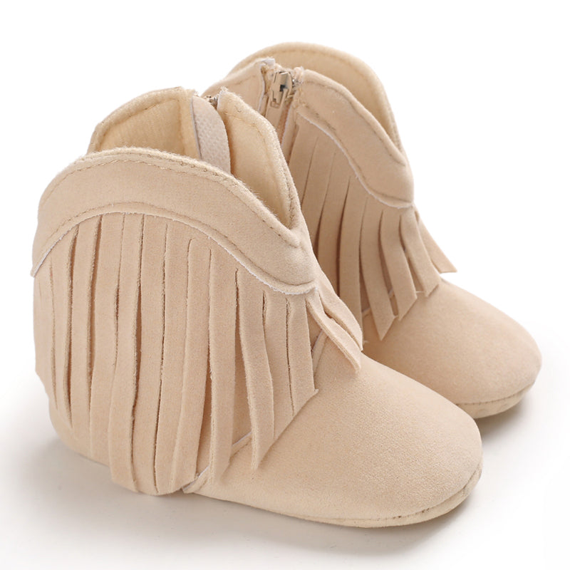 Adorable pink fringe cowboy boots on a toddler girl, perfect comfortable western shoes.