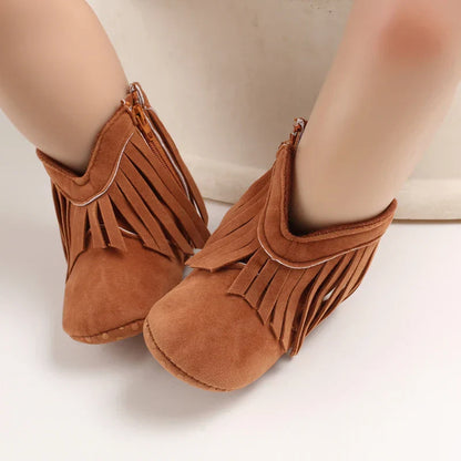Stylish denim-colored fringe cowboy boots for toddler girls, a unique kids fashion statement.
