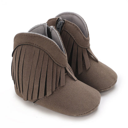 Pair of colorful fringe cowboy boots for baby girls, showcasing vibrant western shoes.