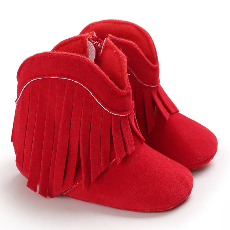Girls' red fringe cowboy boots, bold and trendy western shoes for young children.